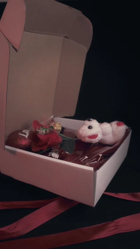 Open Romantic Gift Box with Teddy Bear Roses and Chocolate Valentine Concept Stock Footage 323453569