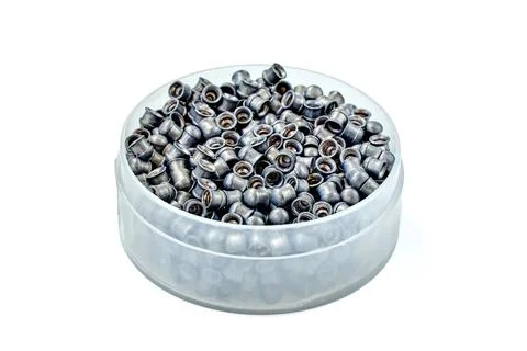 Open round container filled with lead airgun pellets for hunting and target s Stock Photos