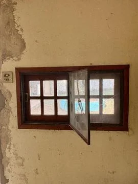 Open rustic window with screen Stock Photos