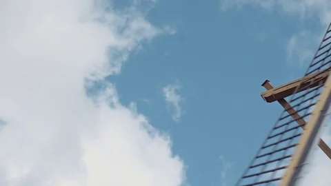The open sails of an old Dutch pumping windmill fly by from top to bottom Stock Footage 85215160