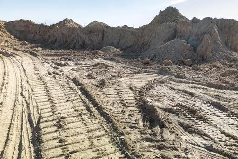 Open sand pit, for sand extraction during construction. The texture of sand a Photos