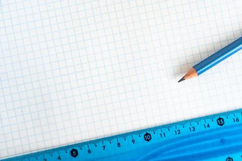 Open school notebook with a simple pencil and a ruler on a white table. back to Stock Photos