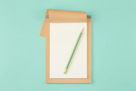 Open school notepad on green background Stock Photos