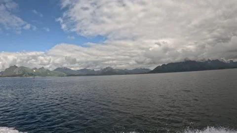 Open sea navigation pole with boat spray and mountains Lofoten Vidéo 344047597