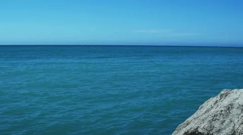 The open sea with small waves breaking the Stone Stock Footage 62808642