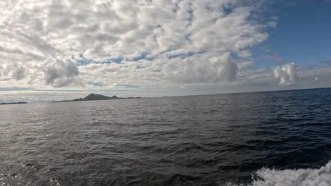 Open sea view with distant islands and dramatic overcast clouds Lofoten 库存影片 344047342