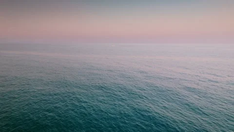 Open sea view at sunset with calm water, drone aerial shot Stock Footage 311358165