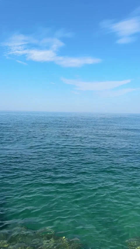 Open sea waves and blue sky with clouds, vertical video. Stock Footage 337677968