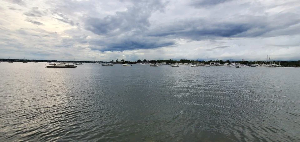 Open seashore with cloudy sky Stock Photos