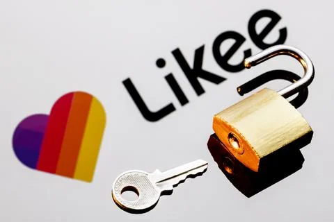 An open security lock and key on background of Likee logo Stock Photos