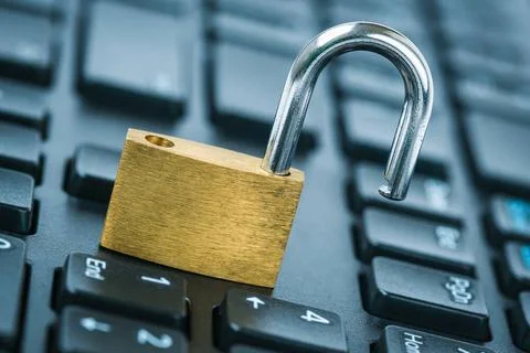 Open security lock on computer keyboard - computer security breach concept... Stock Photos