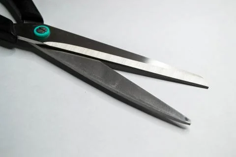 Open shears or scissors isolated on white background. Shot of close up view o Stock Photos