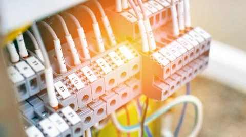 Open shield with wires of the control and measuring device at the production Stock Photos