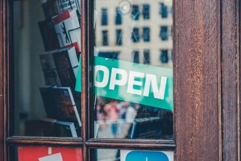 Open sign in shop window - open sign in store entrance - Stock Photos