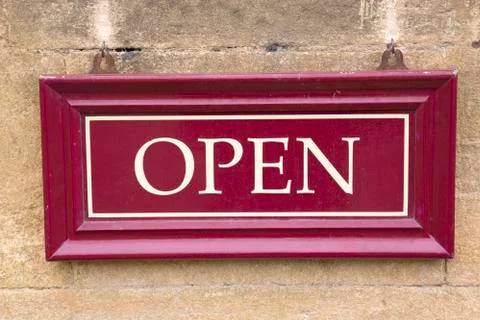 Open Sign on Stone Wall Foto stock
