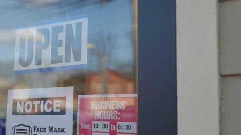 Open sign through glass window Mask Requirement sign Business Hours 스톡 동영상 144064768