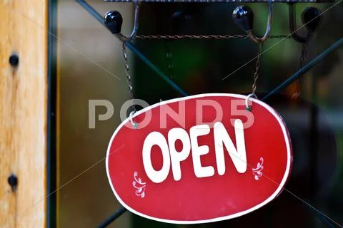 Open sing in front of shop Stock Photos