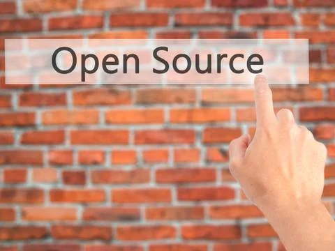 Open Source - Hand pressing a button on blurred background concept on visual  Stock Photos