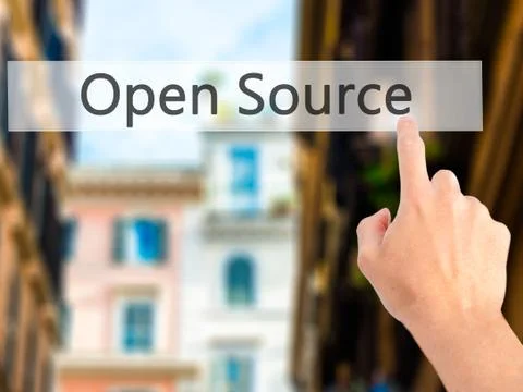 Open Source - Hand pressing a button on blurred background concept on visual  Stock Photos