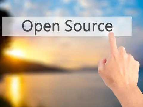 Open Source - Hand pressing a button on blurred background concept on visual  Stock Photos