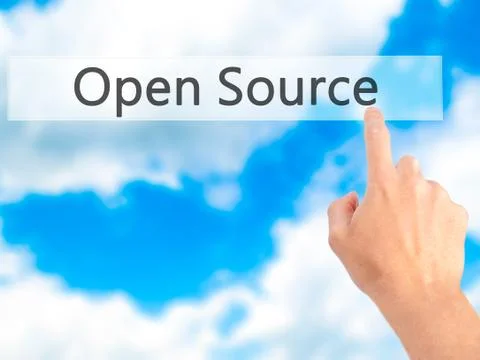 Open Source - Hand pressing a button on blurred background concept on visual  Stock Photos
