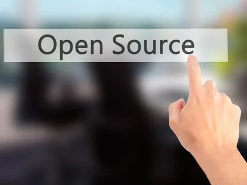 Open Source - Hand pressing a button on blurred background concept on visual  Stock Photos