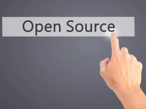 Open Source - Hand pressing a button on blurred background concept on visual  Stock Photos