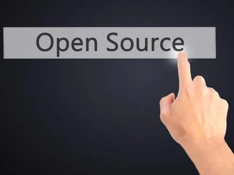 Open Source - Hand pressing a button on blurred background concept on visual  Stock Photos