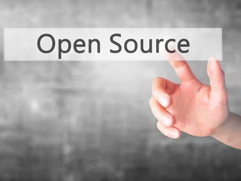 Open Source - Hand pressing a button on blurred background concept on visual  Stock Photos