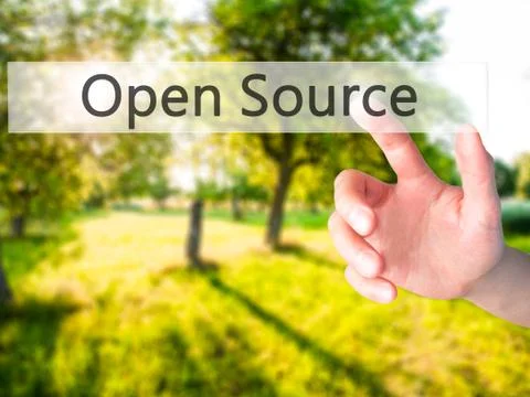 Open Source - Hand pressing a button on blurred background concept on visual  Stock Photos