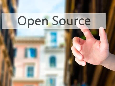 Open Source - Hand pressing a button on blurred background concept on visual  Stock Photos