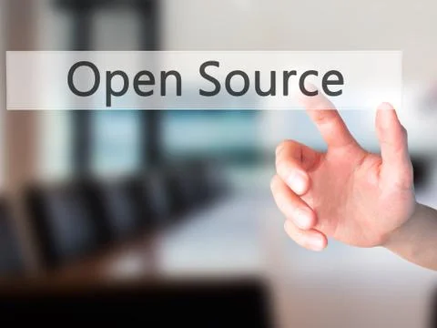 Open Source - Hand pressing a button on blurred background concept on visual  Stock Photos