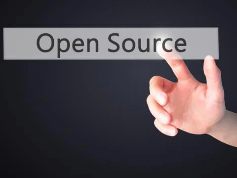 Open Source - Hand pressing a button on blurred background concept on visual  Stock Photos