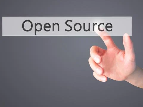 Open Source - Hand pressing a button on blurred background concept on visual  Stock Photos