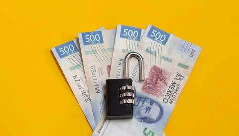 Open source padlock on 500 mexican pesos bills. economy savings and security Stock Photos