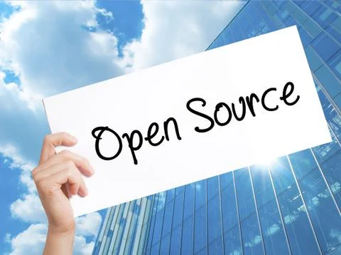 Open Source Sign on white paper. Man Hand Holding Paper with text. Isolated o Stock Photos