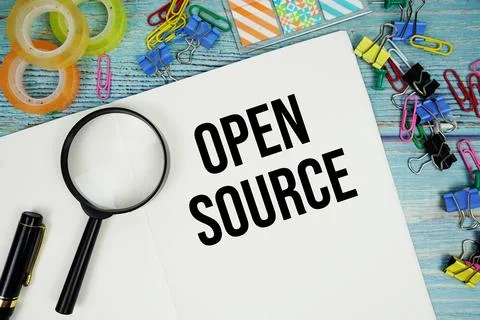 Open Source text written on notepad with alarm clock and magnifying glass f.. 写真素材