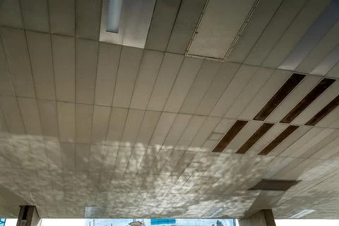 Open space on the base of the skyscraper building with a maintenance holes. Stock Photos