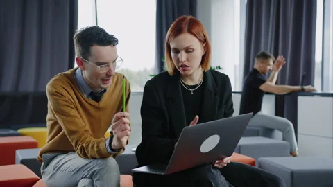 An open space for collaboration in the office. Colleagues during brainstorming Stock Footage 257423163