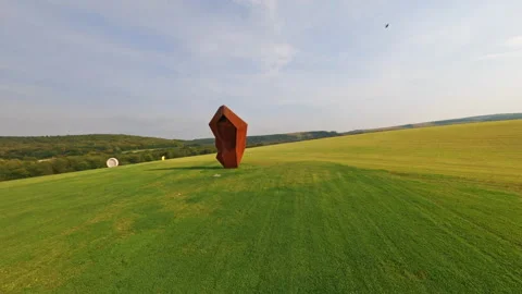 Open space. FPV fast flight near cottage town. Speed motion. Green field with Stock Footage 183452592