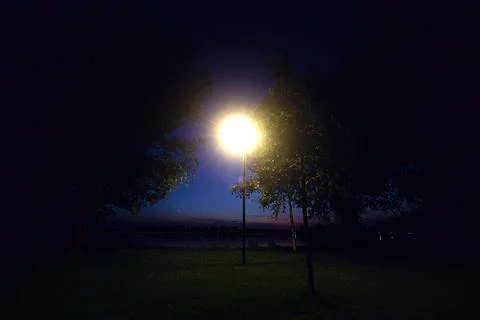 Open space by the lakeshore at dusk Stock Photos