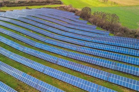 An open space solar system between fields and meadows in Germany from a dr... Stock Photos