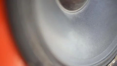 Open speaker in soft focus, close up. Playing music speaker moving Stock Photos