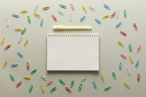 Open spiral notepad on gray background Stock Photos