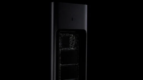 Open SSD Case with inside High-Speed M.2 on black background, External USB Drive Stock Footage 270469491