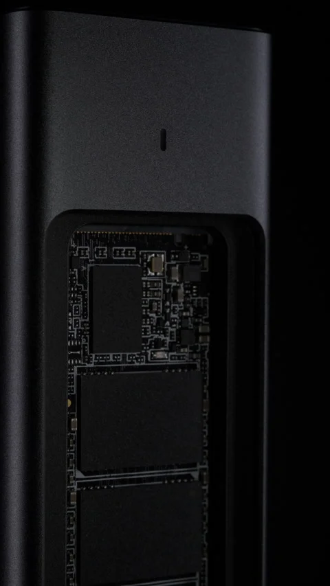 Open SSD Case with inside High-Speed M.2 on black background, External USB Drive Stock Footage 272969862