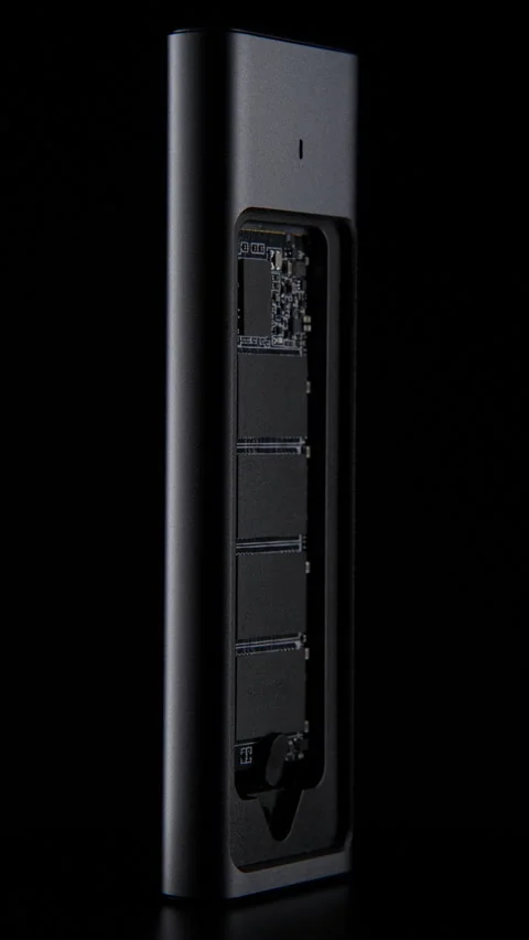 Open SSD Case with inside High-Speed M.2 on black background, External USB Drive Stock Footage 272970547