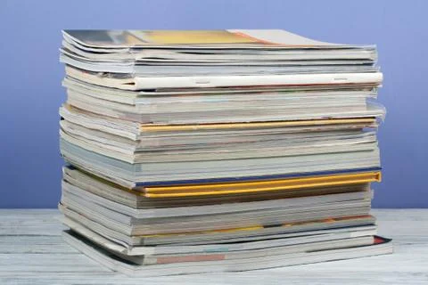 Open stacking book, hardback colorful books, magazine on wooden table and pur Stock-Fotos