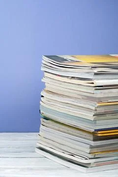 Open stacking book, hardback colorful books, magazine on wooden table and p.. Stock Photos