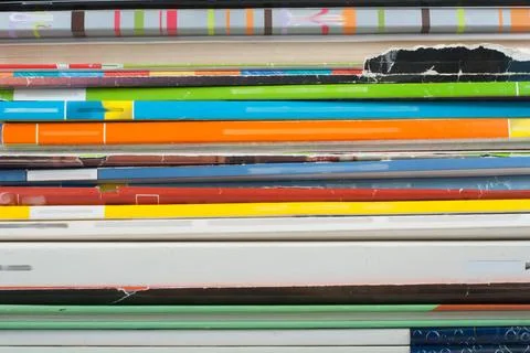 Open stacking book, hardback colorful books, magazine on wooden table and p.. Stock Photos